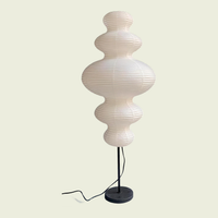 Stacked paper gourd floor lamp, white ribbed shade on slim black stand
