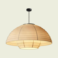 Woven linen dome pendant light with black rod and ceiling canopy, switched on, front view