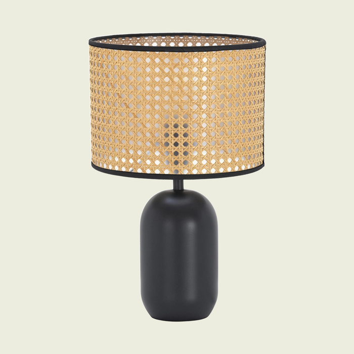 Woven Cane-Style Drum Table Lamp with matte black base, lit