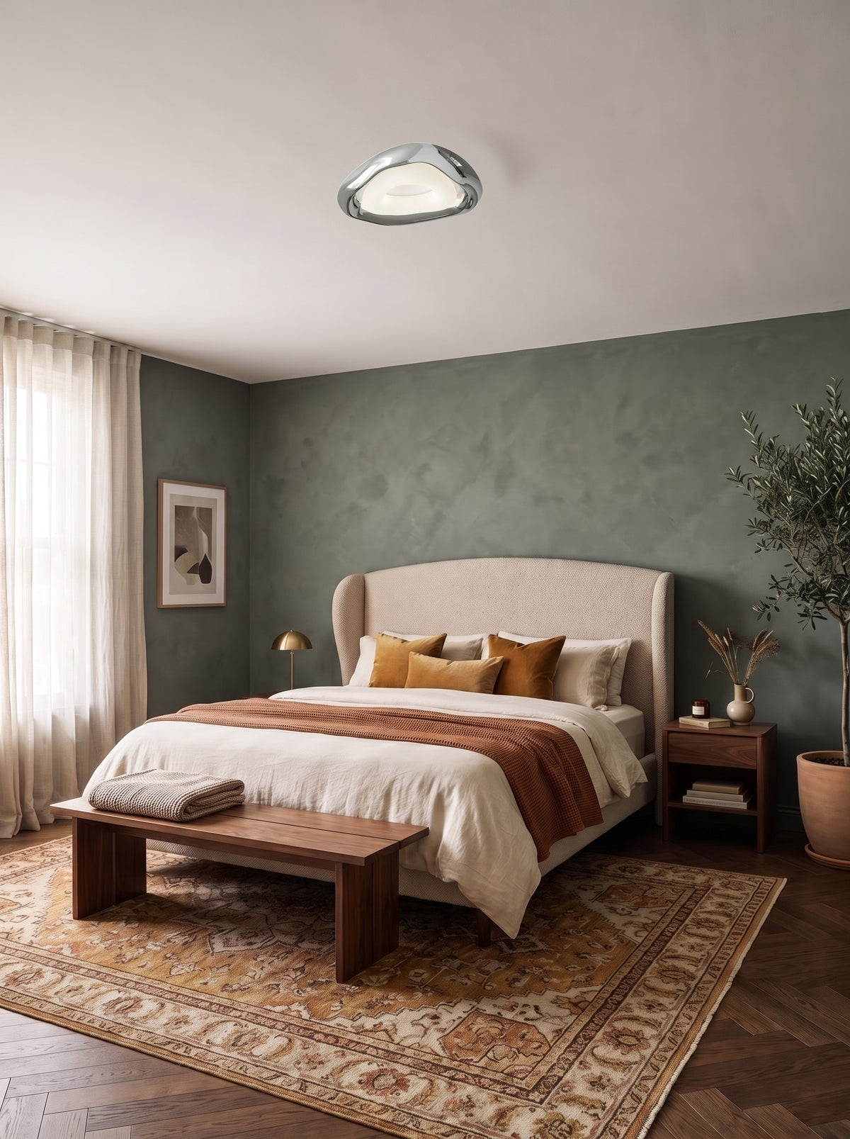 Organic chrome triangle ceiling light on the ceiling of a daylit sage green bedroom