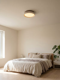 Wood frame ceiling light flush on a bedroom ceiling, daytime