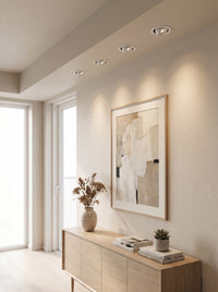 Recessed COB spotlights accenting a wall and artwork, daytime