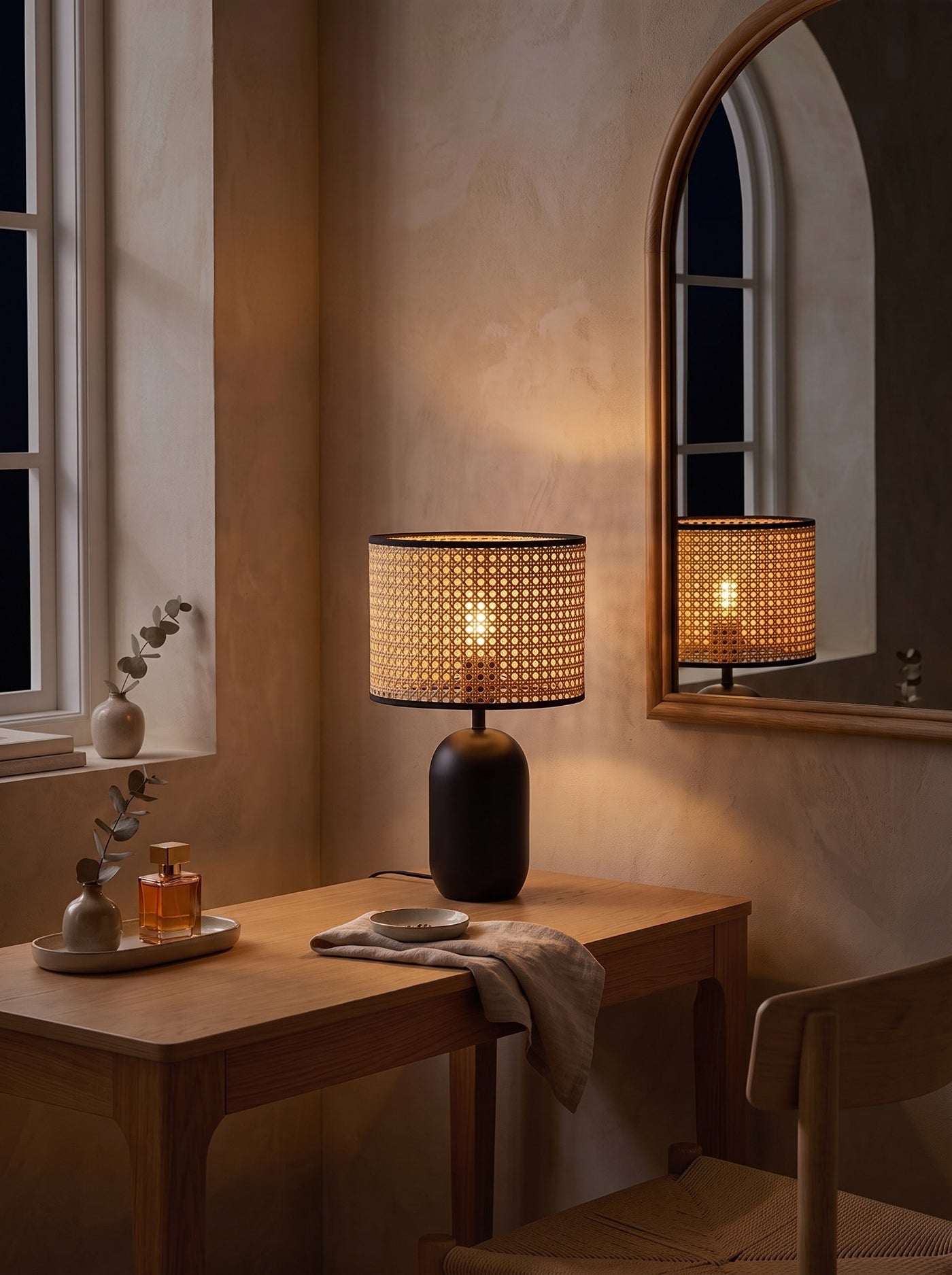 Woven Cane-Style Drum Table Lamp as the only light at night on a dressing table