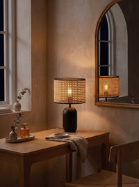Woven Cane-Style Drum Table Lamp as the only light at night on a dressing table