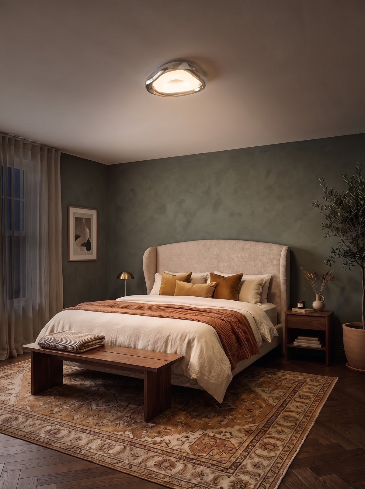 Organic chrome triangle ceiling light switched on in a dark bedroom at night