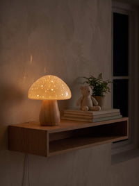 Ceramic Mushroom Table Lamp as the only light at night on a nursery shelf