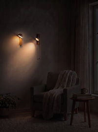 Travertine Wall Sconces as the only light in a reading corner at night
