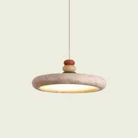Travertine disc pendant light with stacked stone finial, on a hanging cord