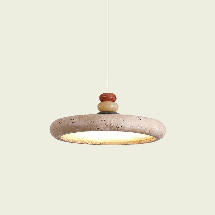 Travertine disc pendant light with stacked stone finial, on a hanging cord