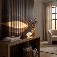 Projection lamp casting a warm feather of light across a wall