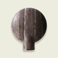 Travertine disc table lamp, front view showing the round stone face