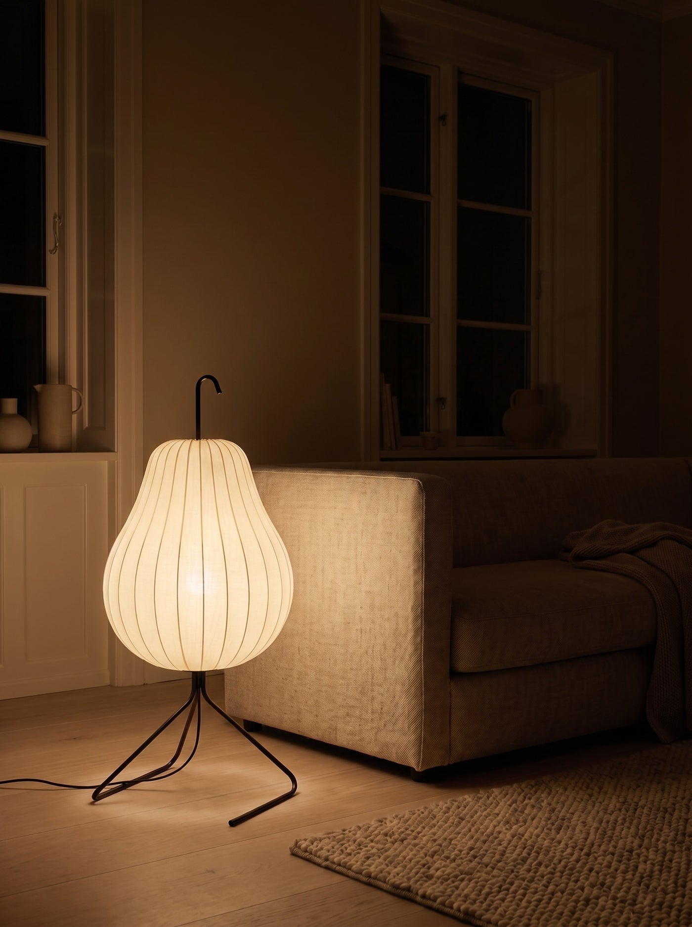 Silk pear floor lamp glowing warm at night