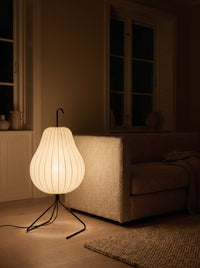 Silk pear floor lamp glowing warm at night