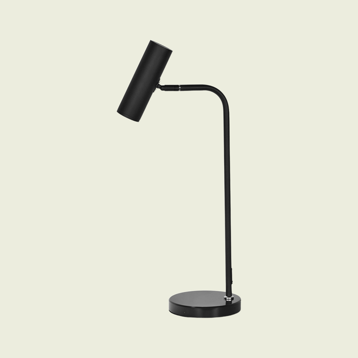 Black spotlight floor lamp with black metal base, on a cream background