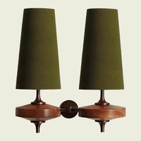 Green fabric double cone wall sconce on twin walnut mounts, front view