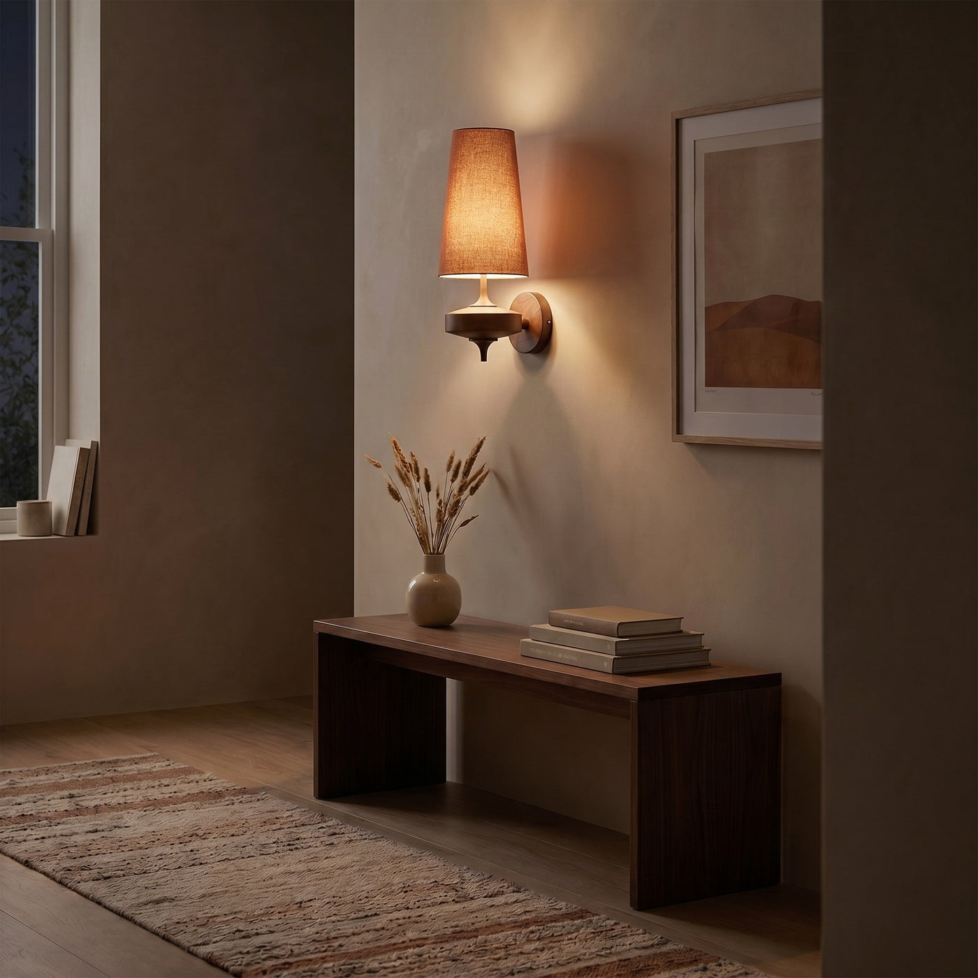 Red cloth cone wall sconce glowing warm in a dark hallway at night