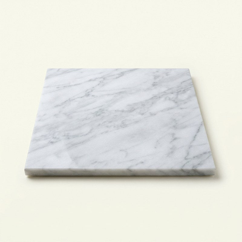 Polished white marble sample with soft grey veining